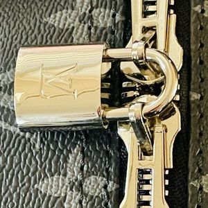 Louis Vuitton Silver Lock/Key 318 100% authentic